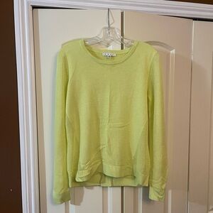 CABI bright green sweater with a relaxed fit and crossed slit back